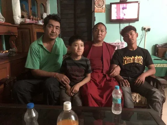 Members of the Tibetan community gathered together at a meal