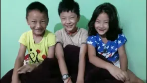 A low-income Tibetan family the foundation stands beside